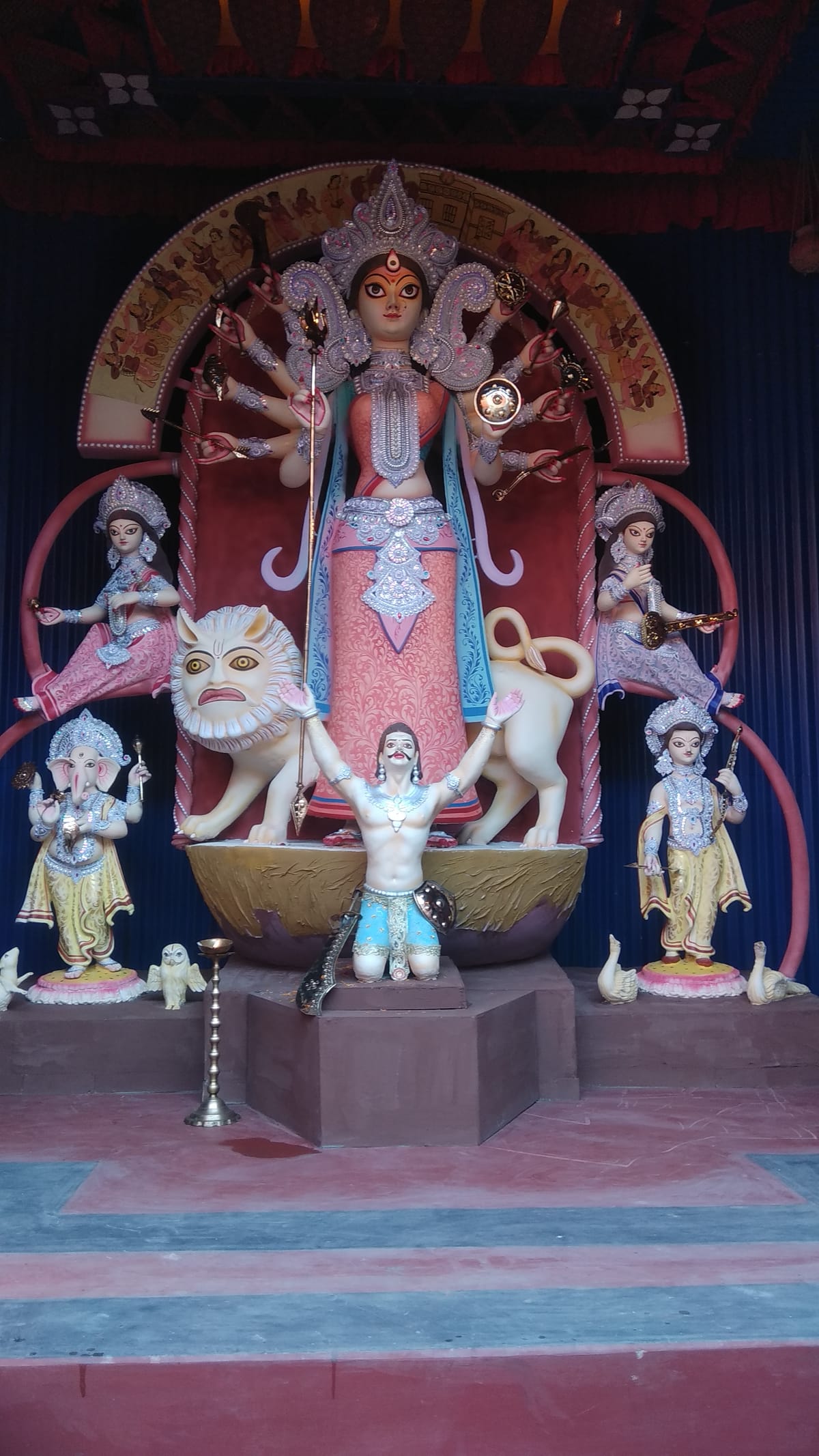 Ornately decorated Durga idol at a festival pandal